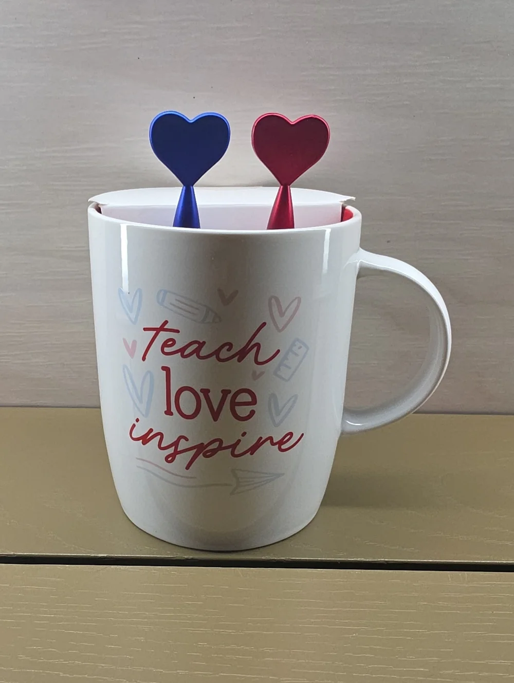 Teach Love Inspire White Ceramic Mug with Red and Blue Heart Pens